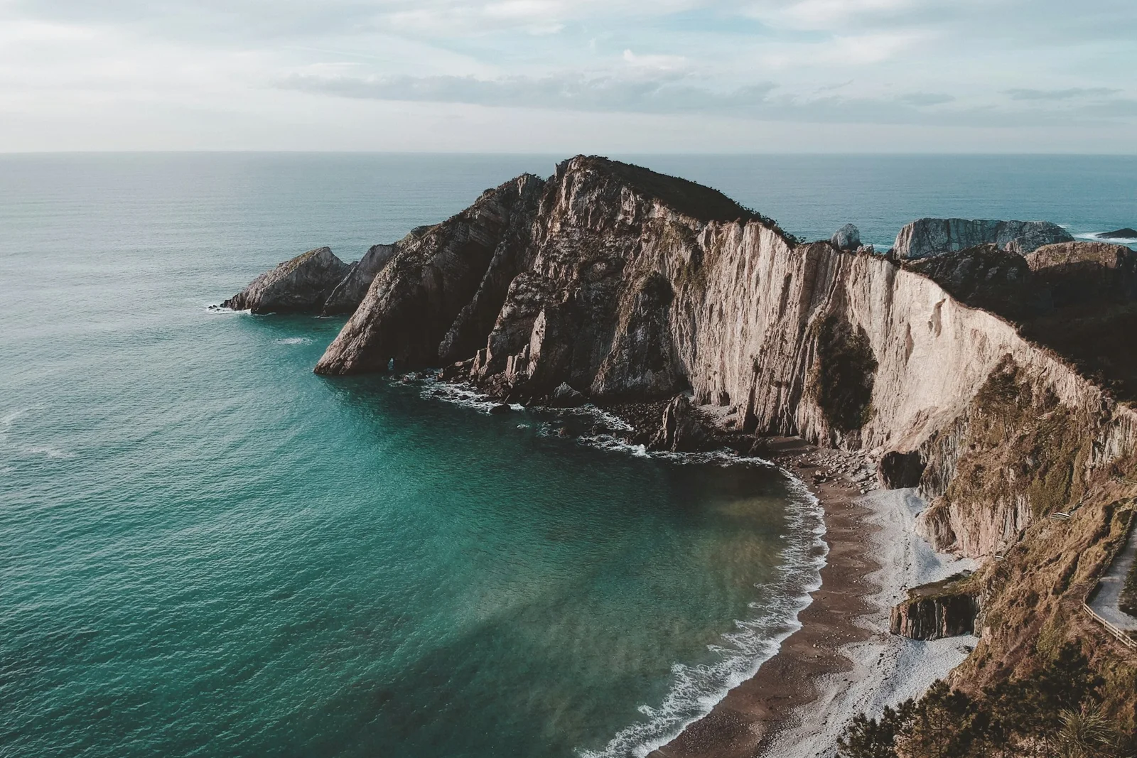 Aerial view of Playa del Silencio, a beach backed by cliffs in Castañeras, Asturias, Spain
